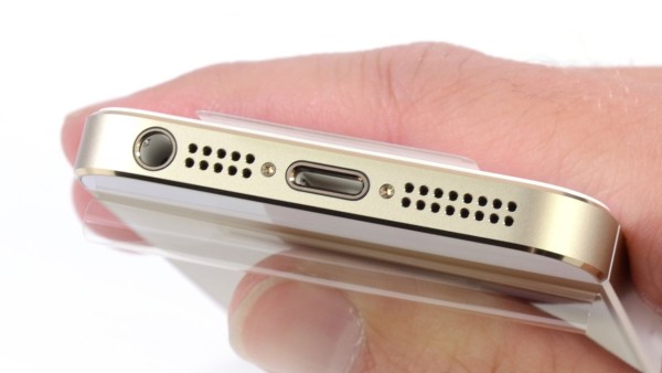 The bottom side of an old iPhone. You can see the phone has a headphone jack and a usb port. 