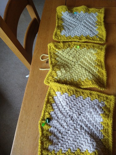 Row for three crochet squares in beige and yellow 