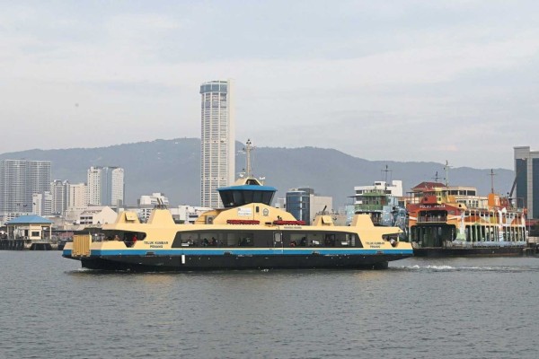 Penang Ferry full with passengers, cyclists, and motorcyclists, moving on the sea. / Photo from linked article.