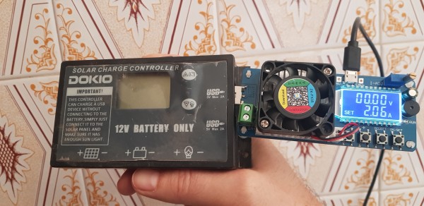 A DOKIO 12V 20A Solar Charge Controller has a USB load tester plugged into one of its USB ports.

The tester shows that the load was set to 2.06 A, while the USB port label says 5V Max 2A.