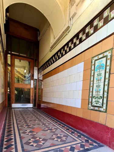 A tenement close decorated with beautifully crafted tiles.