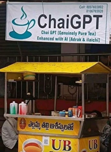 A small street vendor selling beverages possibly in India, I'm not sure. Over them is a large sign which reads "ChaiGPT (Genuinely Pure Tea) enhanced with AI (Adrak and Ilaichi)