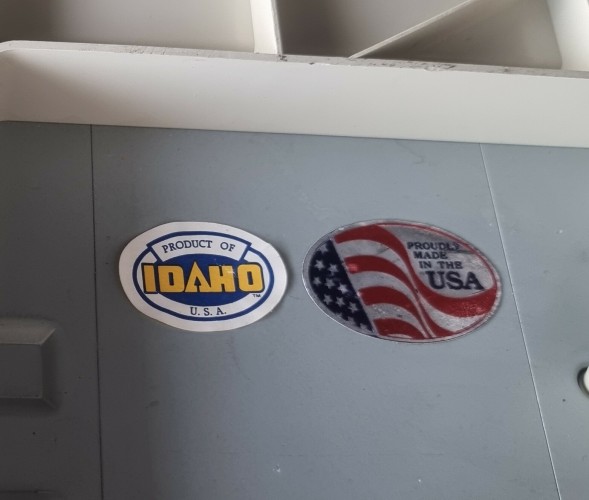 Two stickers, it says product of Idaho usa and the other one says proudly made in the USA 