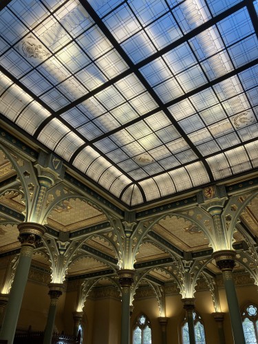 An ornate style gothic glass roof and stone pillars 