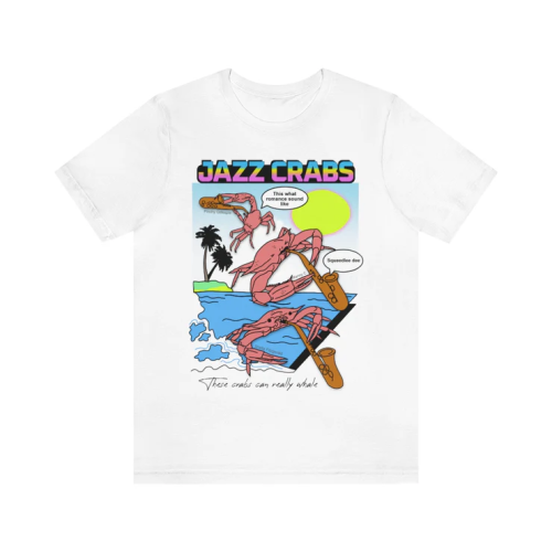 A white t-shirt with a brightly coloured 90-s style print, with gradient text that says "JAZZ CRABS" and three crabs playing the saxophone over a backdrop of the sea, the sun and palm trees. One crab has a speech bubble that says "this what romance sound like" and another one is saying "squeedlee dee". Underneath it says "These crabs can really whale"