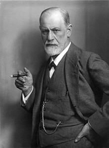 Photographic portrait of Sigmund Freud, signed by the sitter ("Prof. Sigmund Freud")

Black and white portrait of Sigmund Freud with a beard, wearing a suit with a pocket watch chain, holding a cigarette.