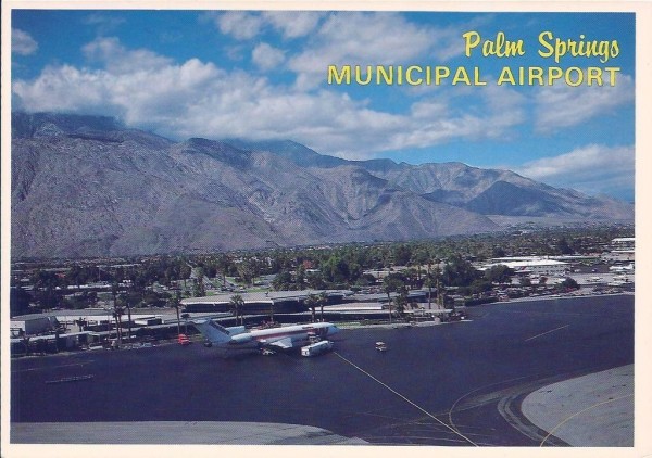 overview of the Palm Springs Airport. There are mountians in the back and old Western Airlines 727 at the terminal