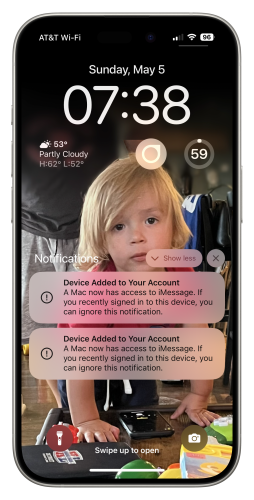 iPhone home screen showing notifications of devices being added to iCloud with a young child as the cover art.