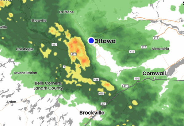 A line of storms is shown on weather radar, approaching ottawa in a big blob of yellow and red, coming up from the lower right (southwest)