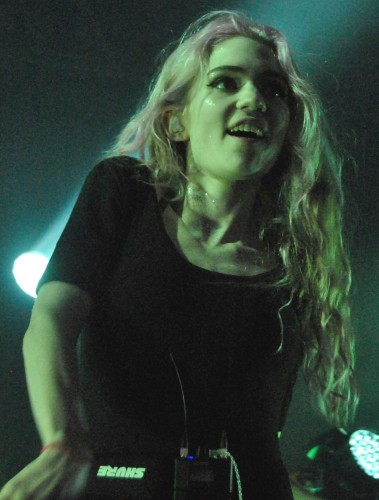 Grimes (the musician) performing at the Governors Ball Music Festival in New York City, June 2014

Jordan Uhl, CC BY 2.0 <https://creativecommons.org/licenses/by/2.0>, via Wikimedia Commons