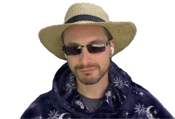 Me in sunglasses with a straw hat, wearing a dark purple blue oodie 