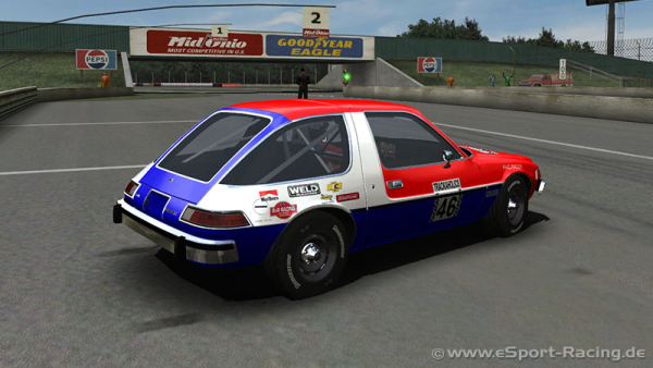 A 1977 AMC Pacer hatchback painted in red, white, and blue, with sponsor stickers from Marlboro, Weld, Sunoco and some unreadable companies. The door says "Trackaholics 46" and the credit in the bottom right corner is from www[dot]esport-racing[dot]de