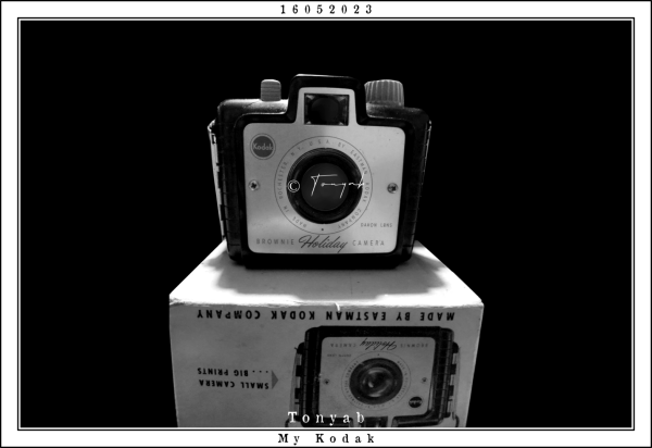 Black and white photograph of a Kodak camera "Brownie Holiday Camera" on its original box, which I still keep.