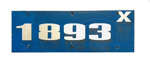 Dirty blue riveted number plate, blue background, number 1893X