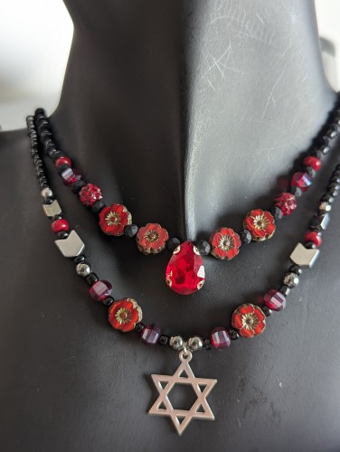 handmade beaded red set of red flower beads, glass red drop, silver Star of David, arrow and glass red beads and black beads. tw layered necklaces inspired by Calanit flowers blooming at the location of the oct 7th massacre. 