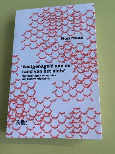 Red and white cover of the mentioned book.