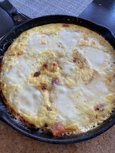 Frittata with melted mozza in a cast iron pan 