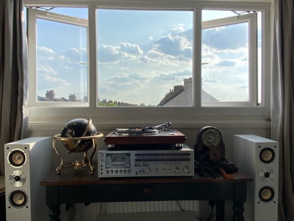 Photo of my hifi with a beautiful sunny day out the picture window in the background 