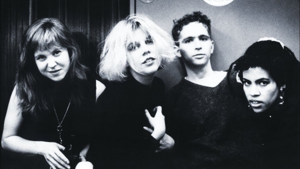 A black and white full band photo of Throwing Muses in the 1990s. Kristin Hersh front and center.