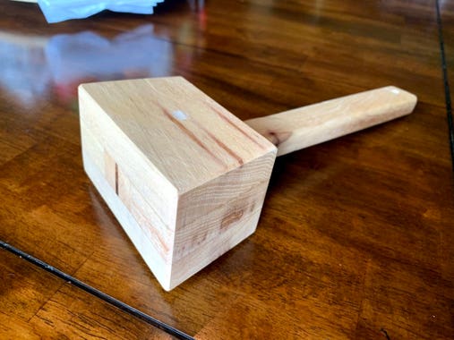 a woodworking mallet made from pecan wood