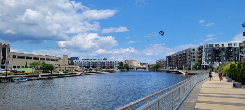 Four blue angels jets flying over the Milwaukee river in a diamond formation