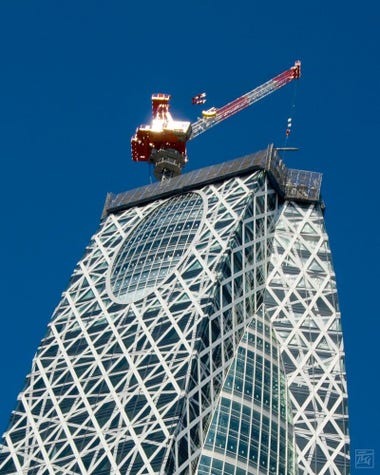 crane on top of a nearly complete Cocoon Tower