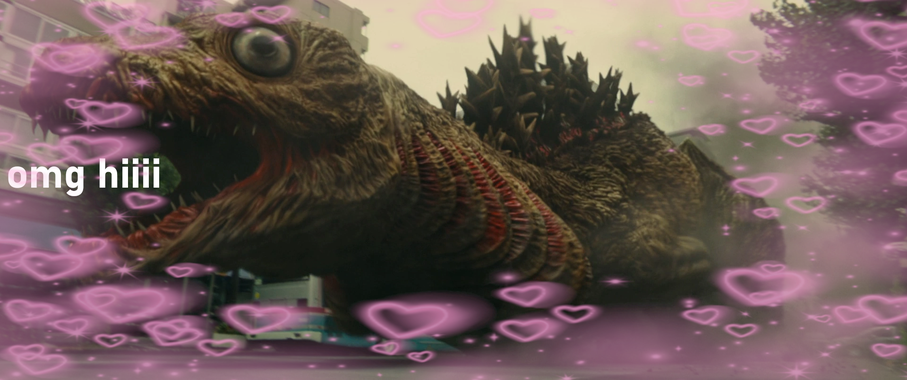 The second form of Shin Godzilla, surrounded by glowing hearts and saying "omg hi"!