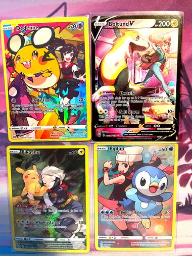 Pokemon cards, trainer gallery arts: Dedenne with Kali, Boltund V with Sonia, Pikachu with Akari, and Piplup with Dawn