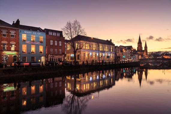 Sullivan's Quay in Cork, reflected in the River Lee at sunset.