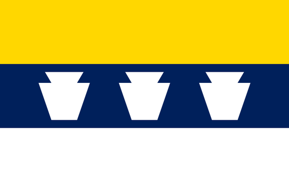A 2:3 horizontal tricolor of (top-bottom) yellow, blue, and white. Blue stripe has 3 white keystones on it.