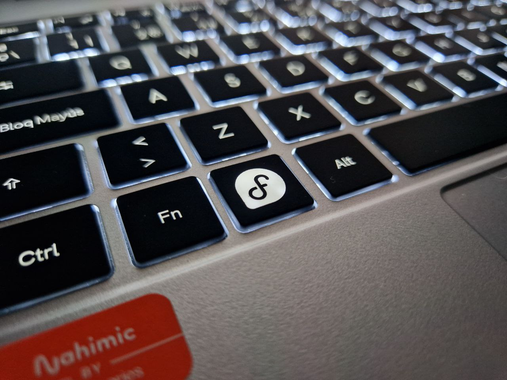 Close up shot of the super key represented with the Fedora logo on the upcoming Fedora Slimbook