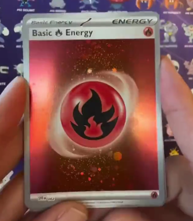 Fire energy card with what looks like a Cosmic Holo pattern from the new 151 set.