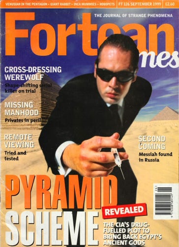 The front cover of Fortean Times No 126 for September 1999, featuring a a spook holding a syringe and standing near a pair of pyramids to illustrate the main article "Pyramid Scheme: The CIA's drug-fuelled plot to bring back Egypt's ancient gods."