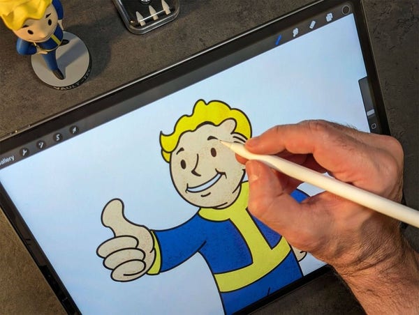 A man drawing the Vault Boy character from the Fallout series using the Apple Pencil on an iPad.