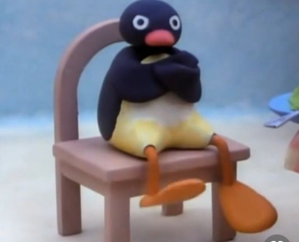 Angry Pingu meme –– a clay penguin from the stop-motion animated show "Pingu", sitting cross-armed with an angry expression.