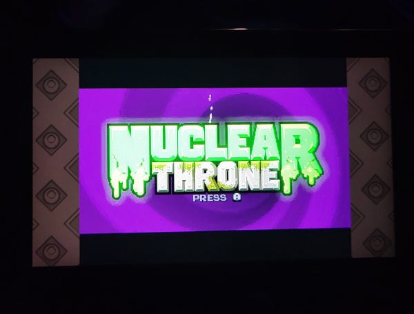 The logo for Nuclear Throne on Switch. Nuclear in green letters, Throne in yellow. 