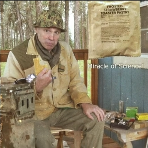 Screenshot of Paul Harrell in his usual "range" garb, eating a Frosted Strawberry Toaster Pastry that was buried in the forest for fourteen years.