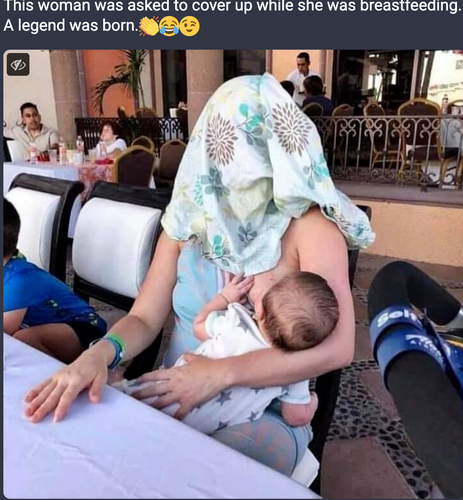 women with blanket over her head breastfeeding her baby. The words read: This woman was asked to cover up while she was breastfeeding. A legend was born.