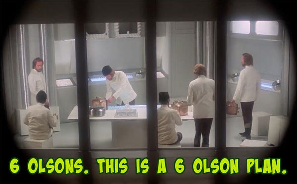 A scene from "Journey To The Center Of The Earth (1977)". Six versions of the character Olson utterly inexplicably work in a futuristic lab hundreds of miles underground. The caption reads "6 Olsons. This is a 6 Olson Plan."