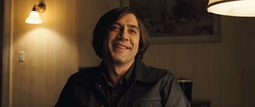 Screenshot from the movie no country for old men. It’s Anton sugar actually smiling warmly even though he’s a horrible villain. It’s probably the only time in the whole movie where he has an authentic smile in my opinion.