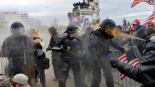 Cops being chemically sprayed by Trump rioters on Jan 6. 