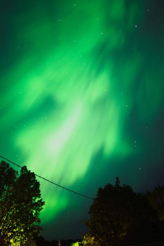 Photo, color, digital. Green aurora borealis appears over the city of Red Wing, MN.