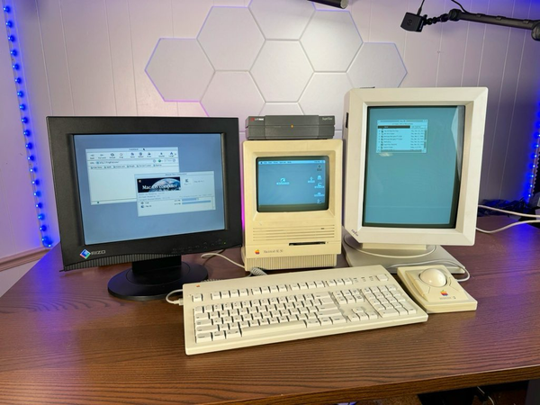 A Mac se30 with a radius monitor in portrait mode and a black eizo lcd