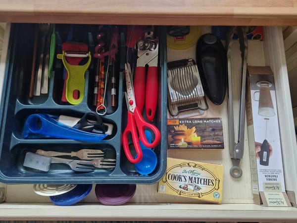 A drawer of all those extra utensils you have no other space for. Chopsticks, peelers, tin openers, matches, tongs, cake forks, an egg slicer, scissors, a milk frother...