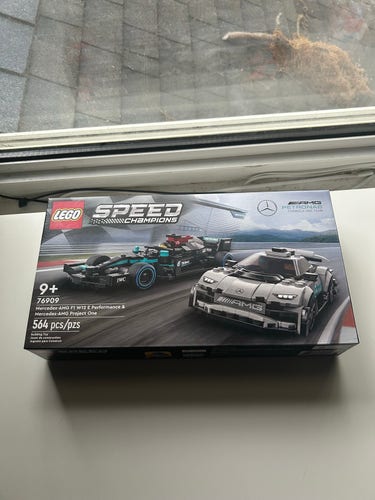 A LEGO Speed Champions box featuring the Mercedes-AMG F1 W12 E Performance & Mercedes-AMG Project One set.