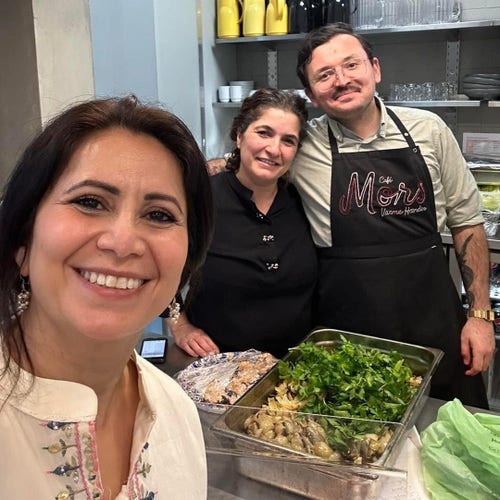 Özlem Cekic (left) and workers from a private Café who did the cooking.