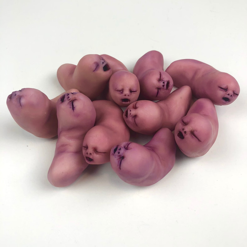 pink fleshy fingers with tiny squinty baby faces wriggling in a pile