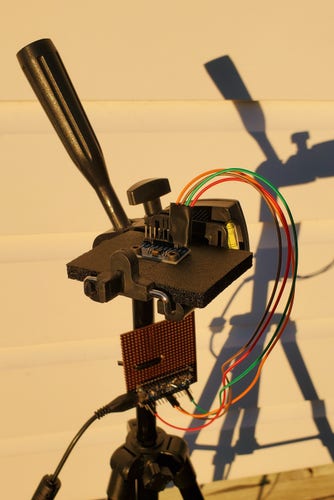 Photo of the MPU9250/6500 accelerometer and magnetometer attached to a tripod.
