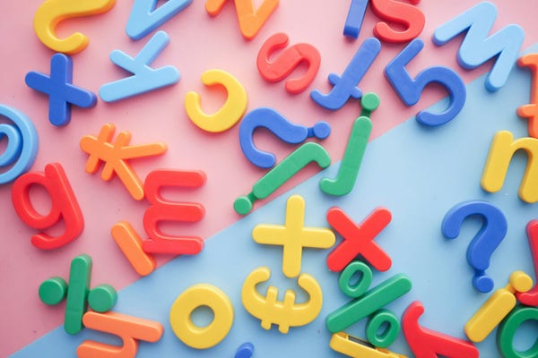a jumble of colourful letters and symbols
