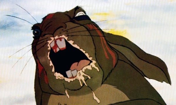 Terrifying still of a screaming cartoon bunny covered in bloody gashes, frothing at the mouth and with one blind eye.